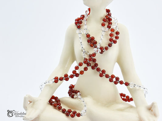 Red and clear beaded necklace on a mannequin against a white background