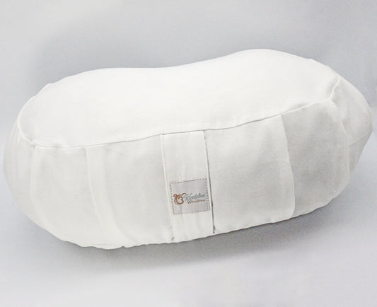 White oval pillow with a brand label on a gray background