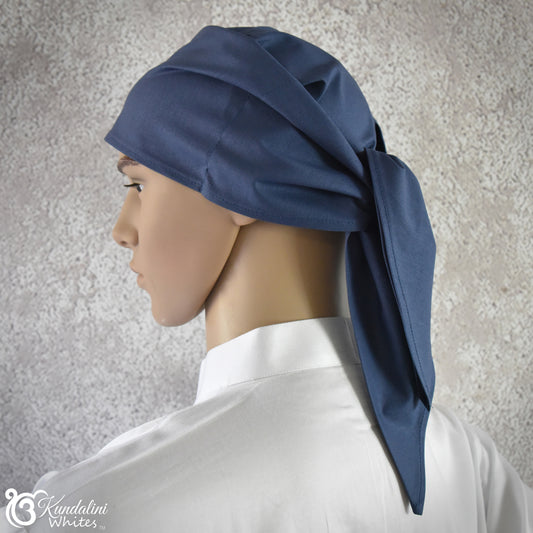 Mannequin head wearing a blue headscarf against a neutral background