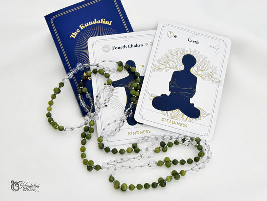 A spiritual kit featuring a blue 'The Kundalini Meditation Oracle' book, a white 'Earth' card with a meditating silhouette, and a green jade and clear quartz mala, arranged on a white background.