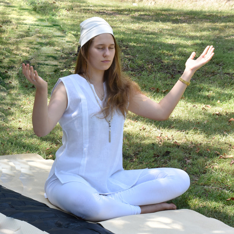 Comfortable breathable Kundalini Yoga clothing on a woman doing celestial meditation