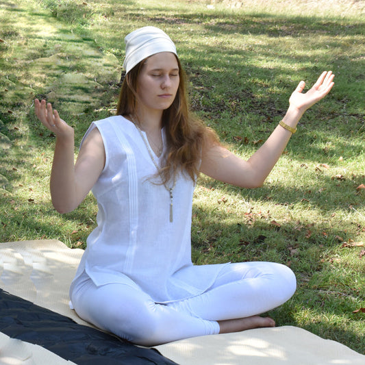 Comfortable breathable Kundalini Yoga clothing on a woman doing celestial meditation