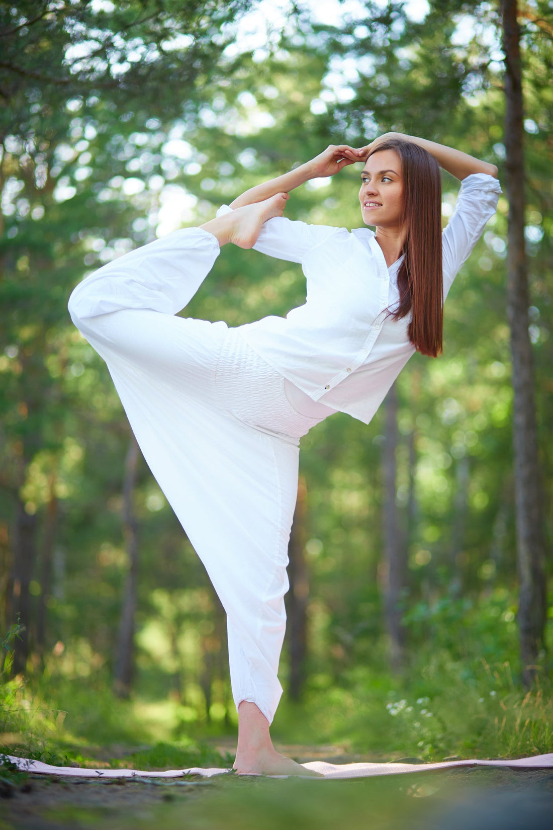 Woman in loose pants stretching