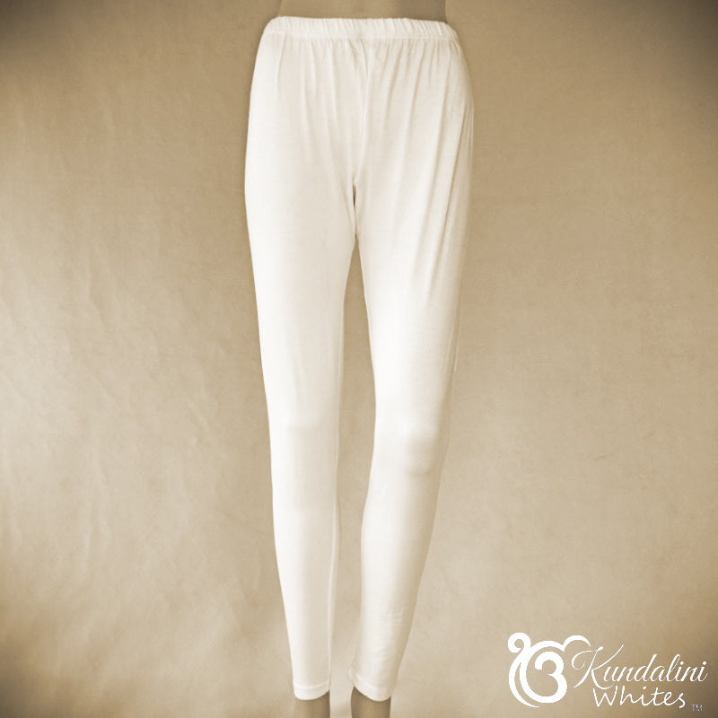 White pants on a beige background with 'Kundalini Whites' branding.