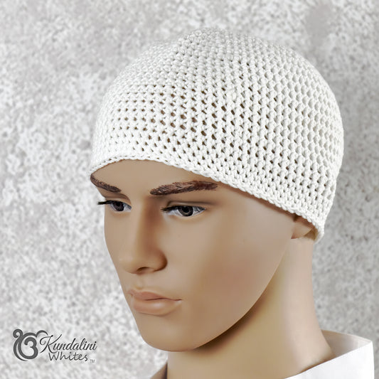 White crocheted mesh cap on a mannequin head against a textured gray background
