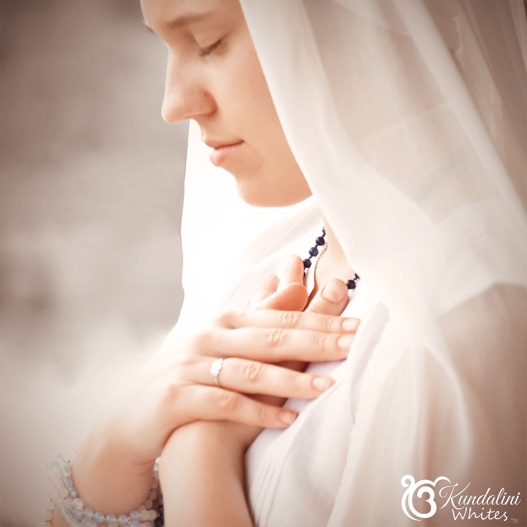 Woman wearing a white headscarf with a blurred background