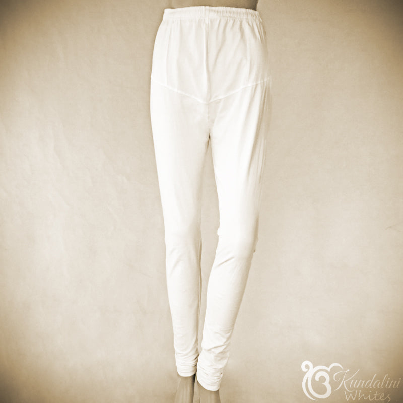 White pants on a beige background with 'Kundalini Whites' branding.