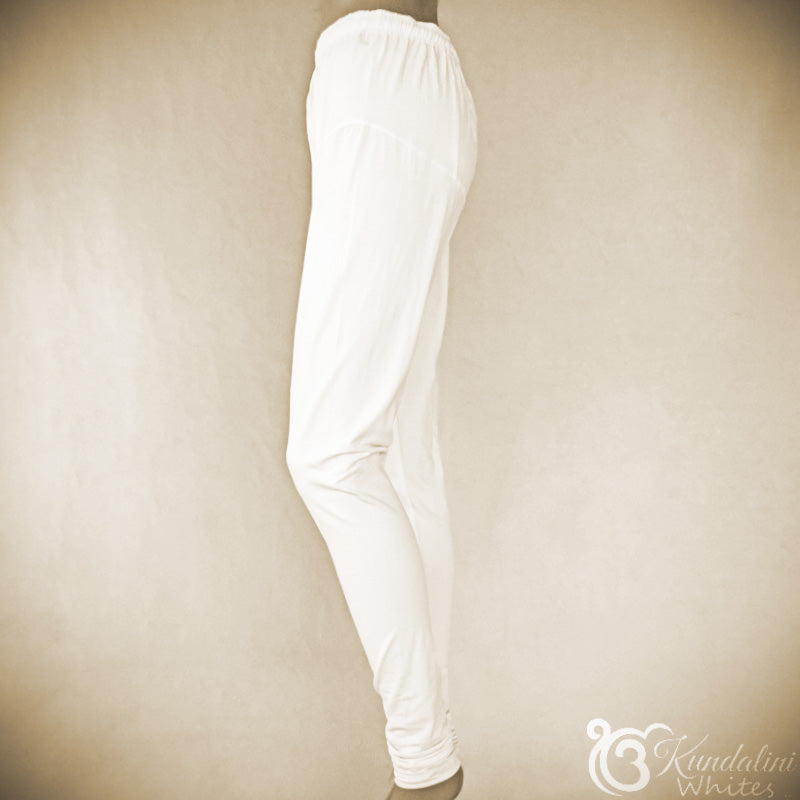 White pants on a beige background with 'Kundalini White' branding.