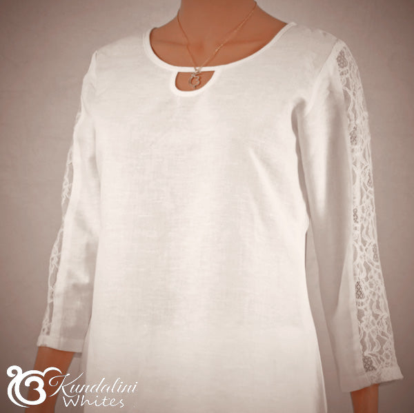 White lace-trimmed top on a neutral background with 'Kundalini Whites' branding.