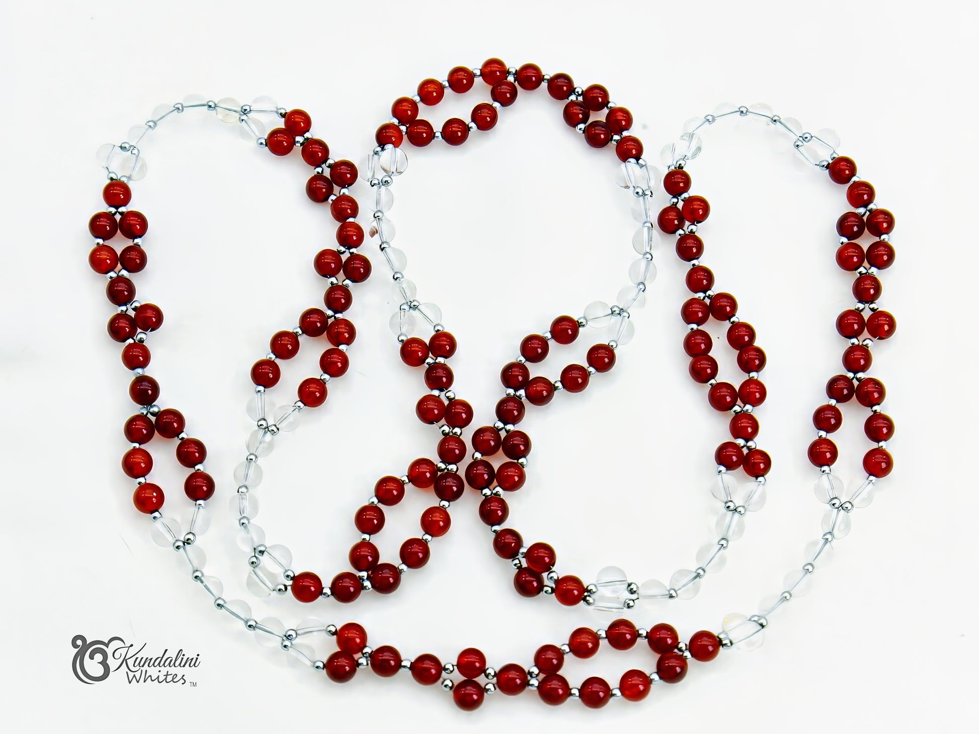 Red beaded tantric necklace with clear beads on a white background