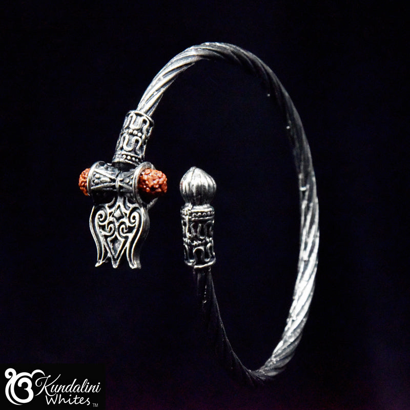 Silver bracelet with decorative elements on a black background