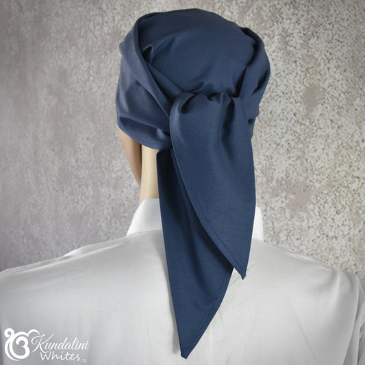 Navy blue headscarf on a mannequin against a gray background