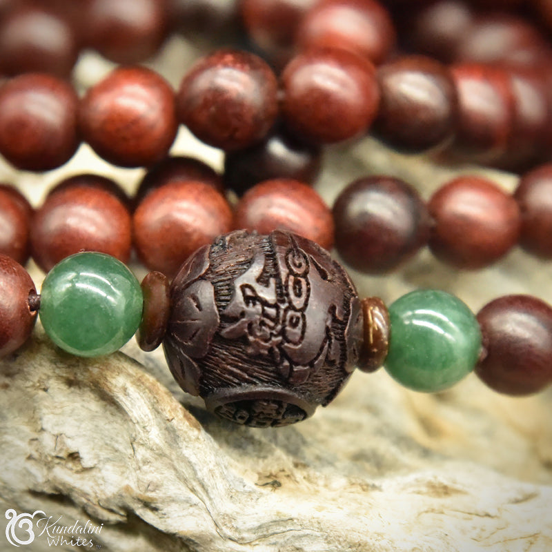 Close-up of a wooden and green beaded bracelet on a natural background