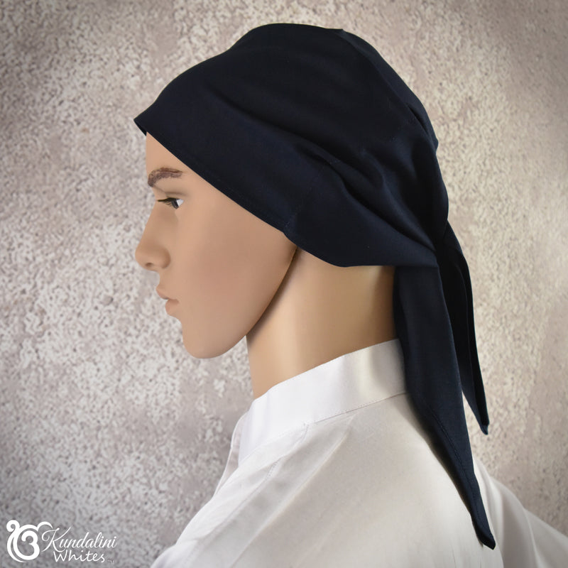 Mannequin head wearing a black headscarf against a neutral background