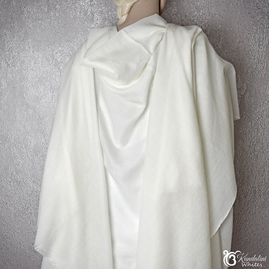 Ivory white meditation shawl draped over a mannequin 