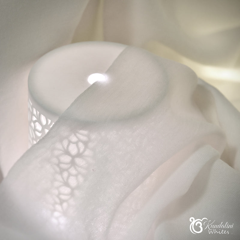 Close-up of woollen shawl's structure on a light background