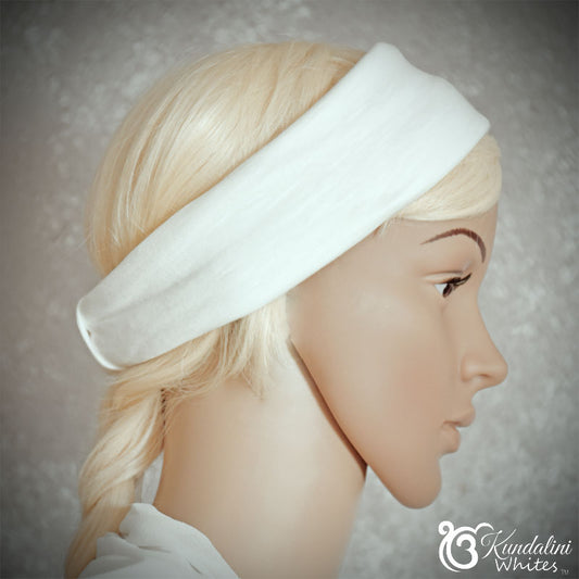Mannequin head with a white headband on a neutral background