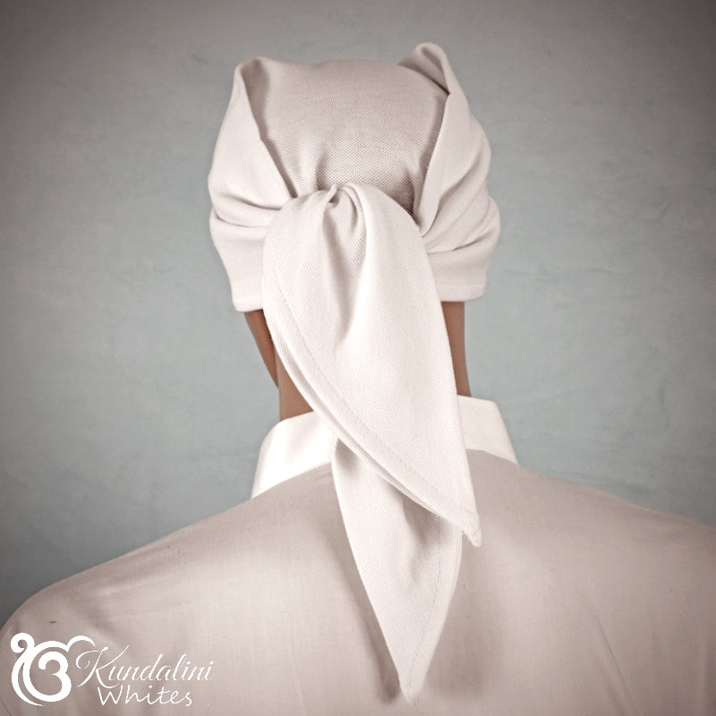 White headscarf tied around a mannequin head against a gray background, with 'Kundalini Whites' branding.