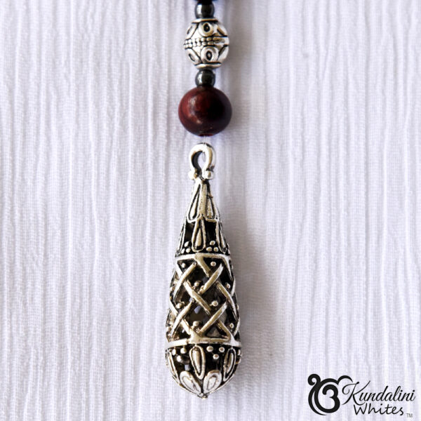 Tibetan teardrop shaped pendant closeup