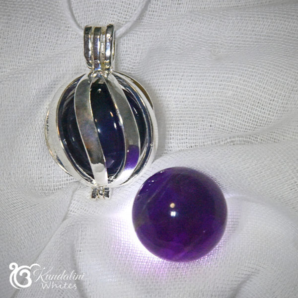 Spiral locket with amethyst