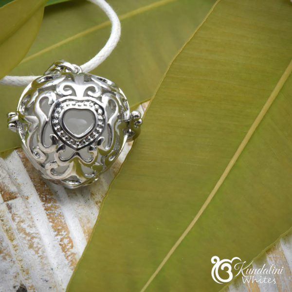 Heart locket and white quartz gemstone