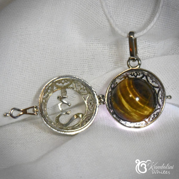 Crystal locket with tiger eye sphere