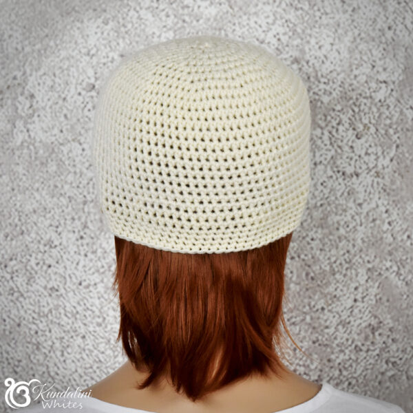 Rear view of woollen skull cap on female model